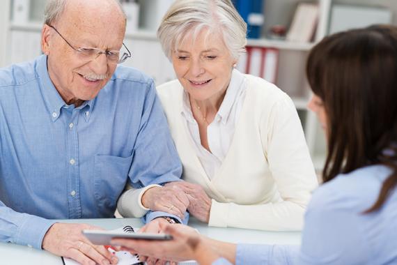 retirement_benefits_senior_couple_meeting_woman.jpg