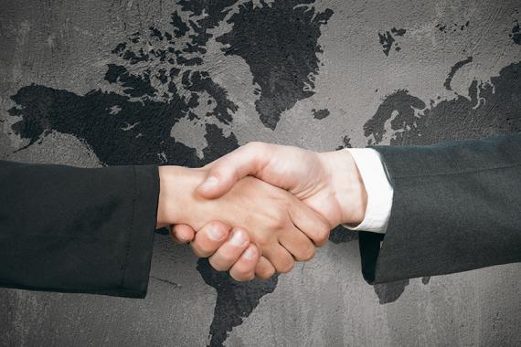 sponsoring_immigrant_business_handshake_grey_map.jpg